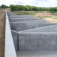 The first labyrinth weir spillway in Missouri was constructed as part of the Lake Winnebago Dam expansion in Cass County. Labyrinth weir spillways are designed to increase spillway capacity without lowering spillway crest.