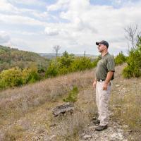 Carl Bonnell, superintendent at Table Rock State Park, takes in a view of the Ozark Mountains near Branson.