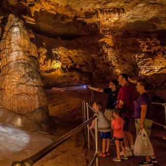 Photo of a family touring Onondaga Cave.