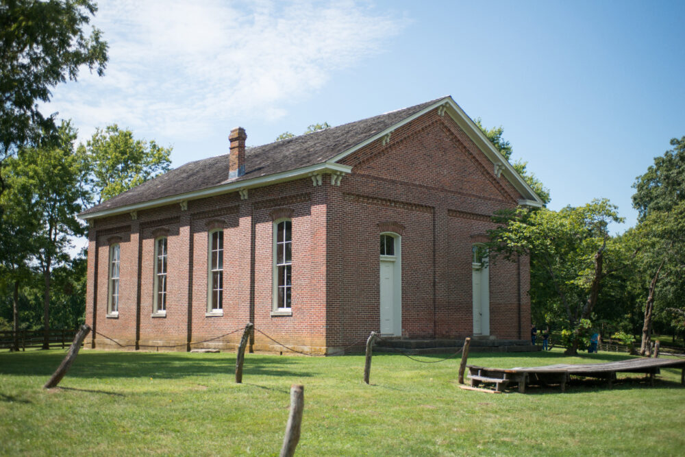 A brick building with tall windows.