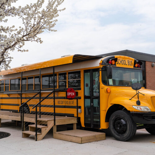 A bus that has been converted into a food truck/coffee shop.