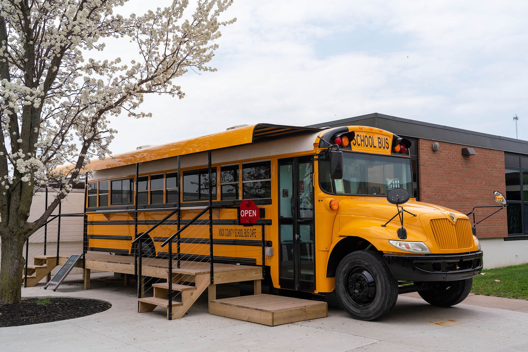 A bus that has been converted into a food truck/coffee shop.