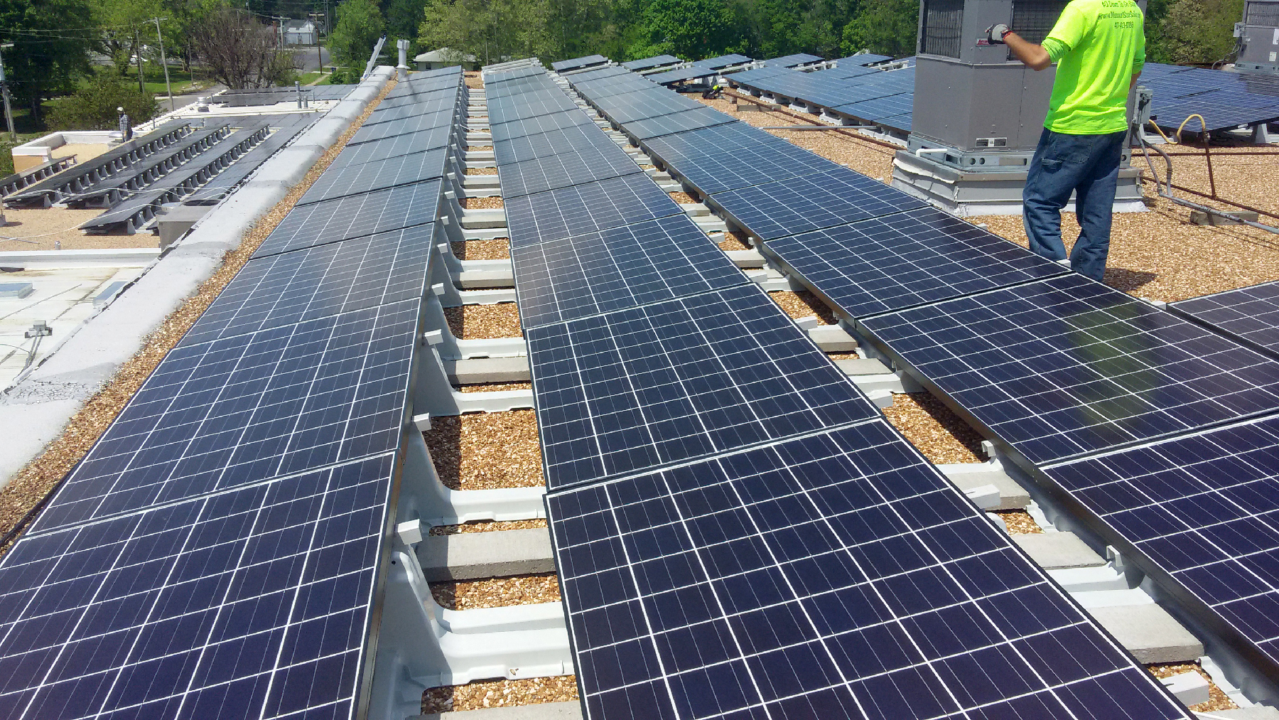 An image of solar panels on the roof of a building.