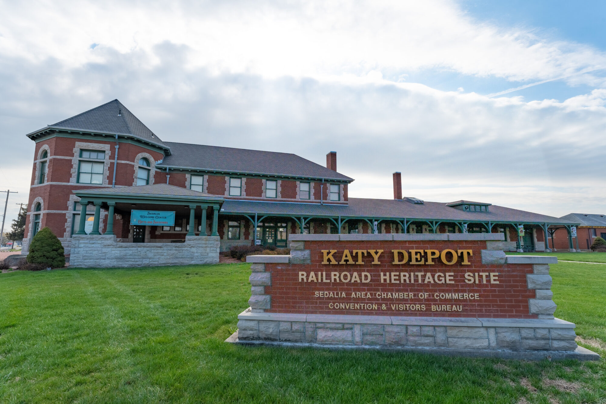 large sign in front of building stating Katy Depot Railroad Heritage Site