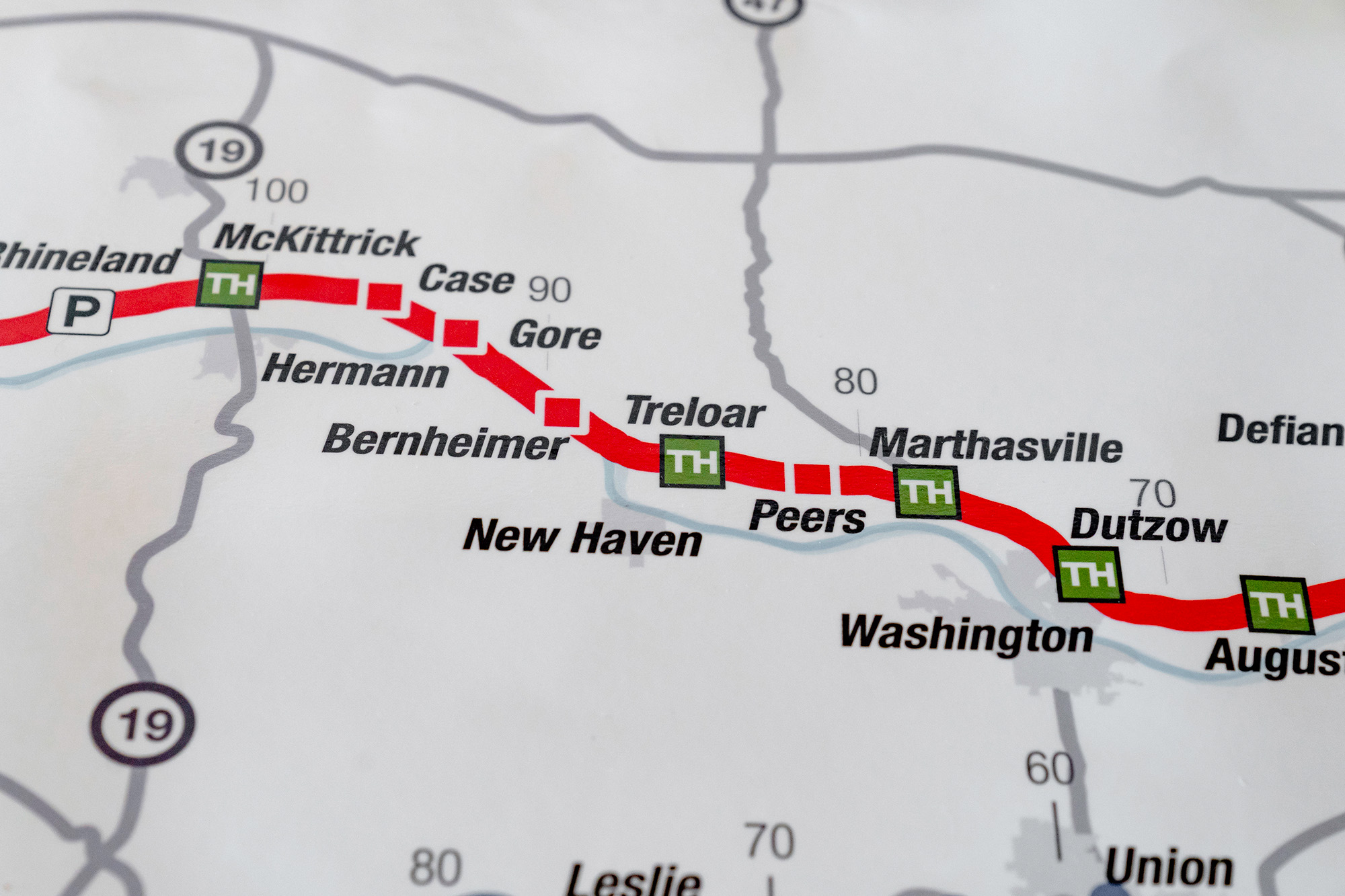 Close up of a map marking a trail and cities, towns, and stops along the trail.